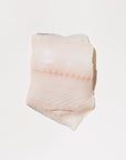 raw black cod on a white portion