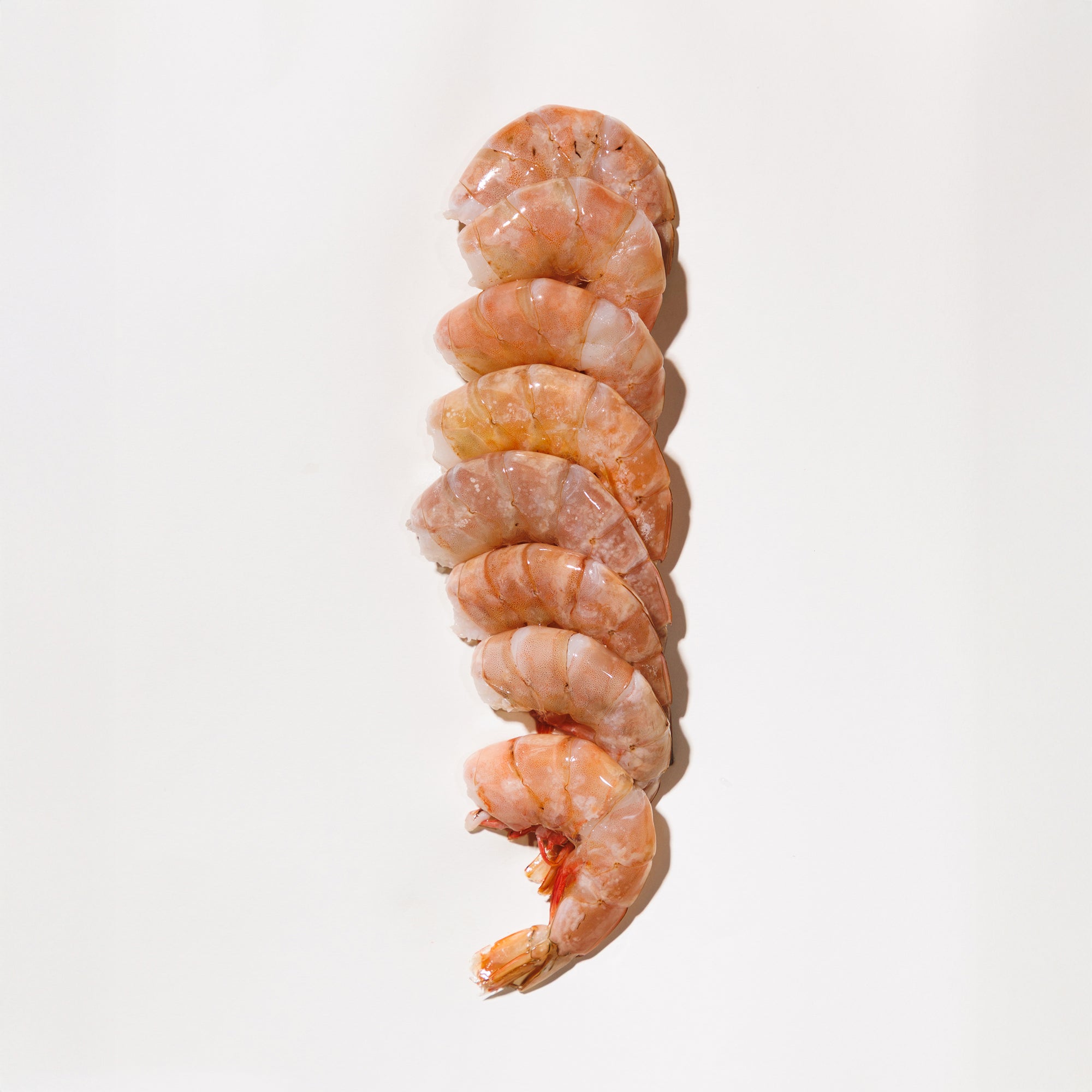 Raw shrimp on a white background