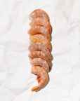 Raw shrimp with shell on a white background