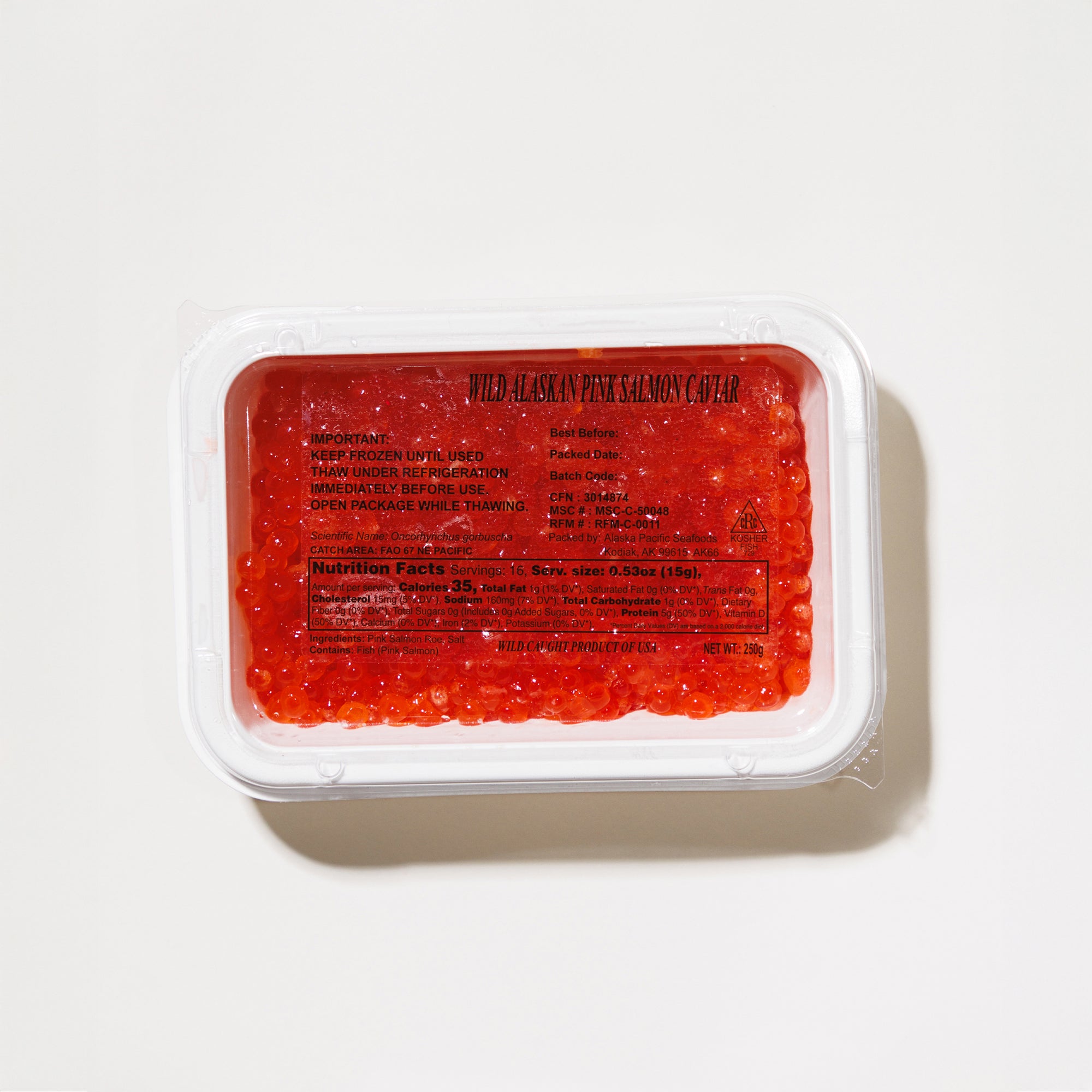 Container of red salmon caviar on a white background