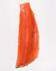 Raw Keta salmon fillet on a white background