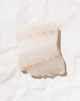 Closeup of wild ling cod on a white paper background