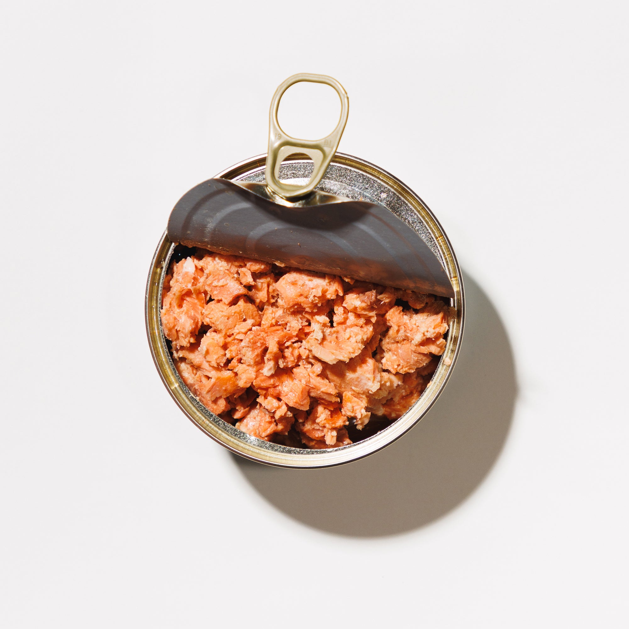 canned boneless skinless salmon with the lid pulled half open