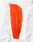 Raw Sockeye salmon fillet on a white paper background