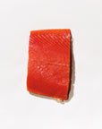 Raw sockeye salmon fillet on a white background