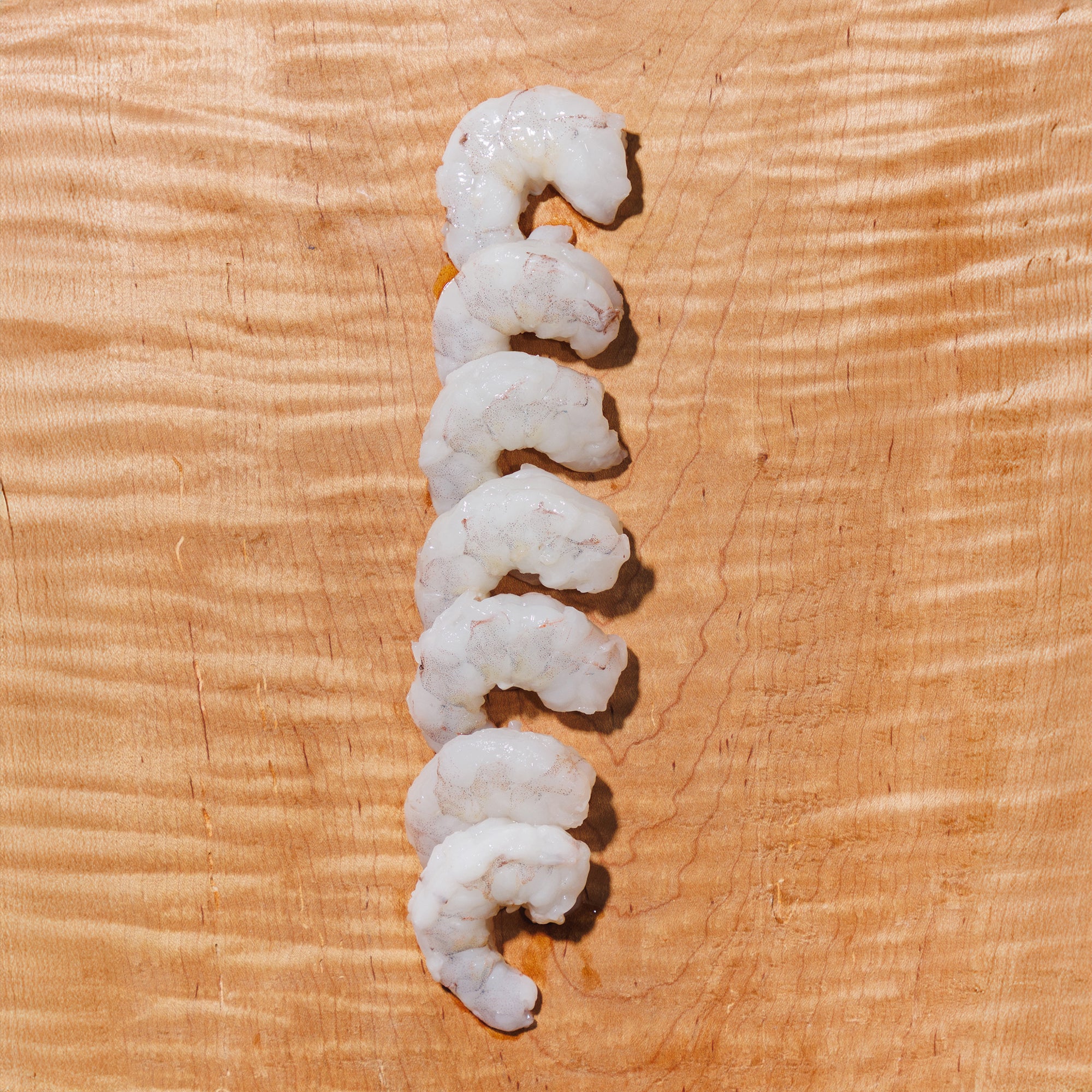 Shrimp on a wooden cutting board