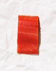 Raw sockeye salmon fillet on a white background