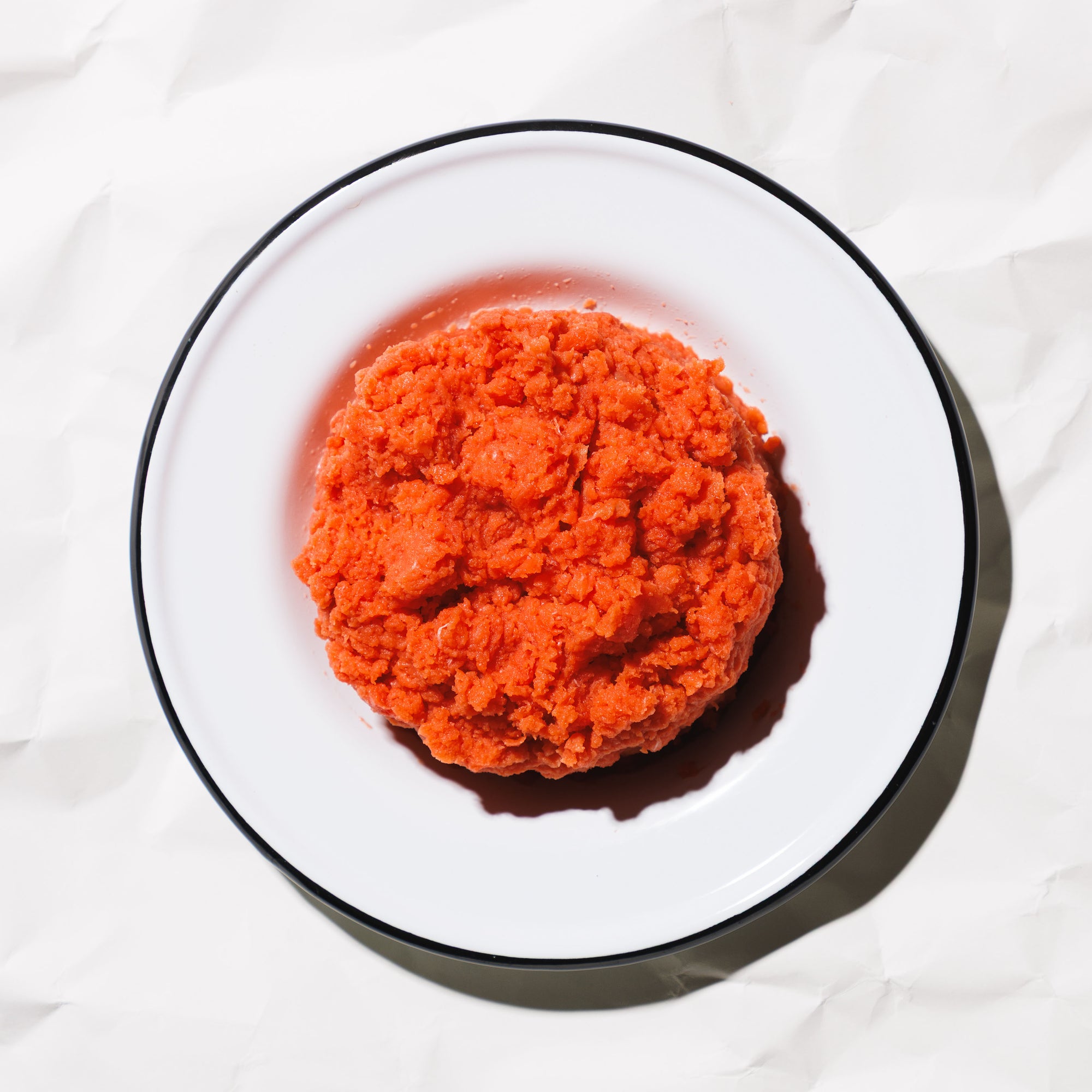 ground sockeye salmon on a white plate on a white background