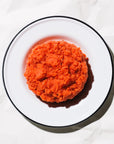 ground sockeye salmon on a white plate on a white background