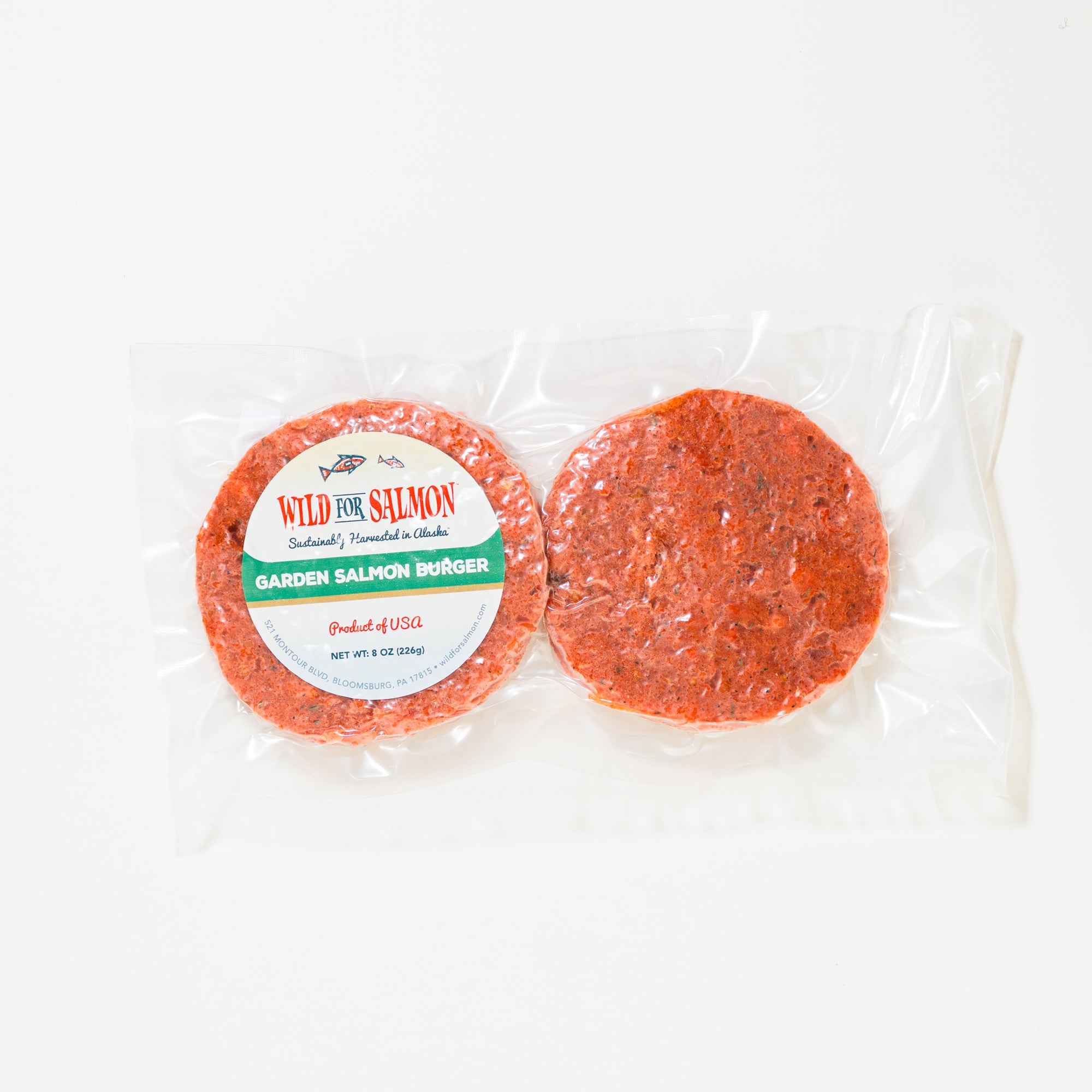 Two salmon burgers in packaging with a label on a white background