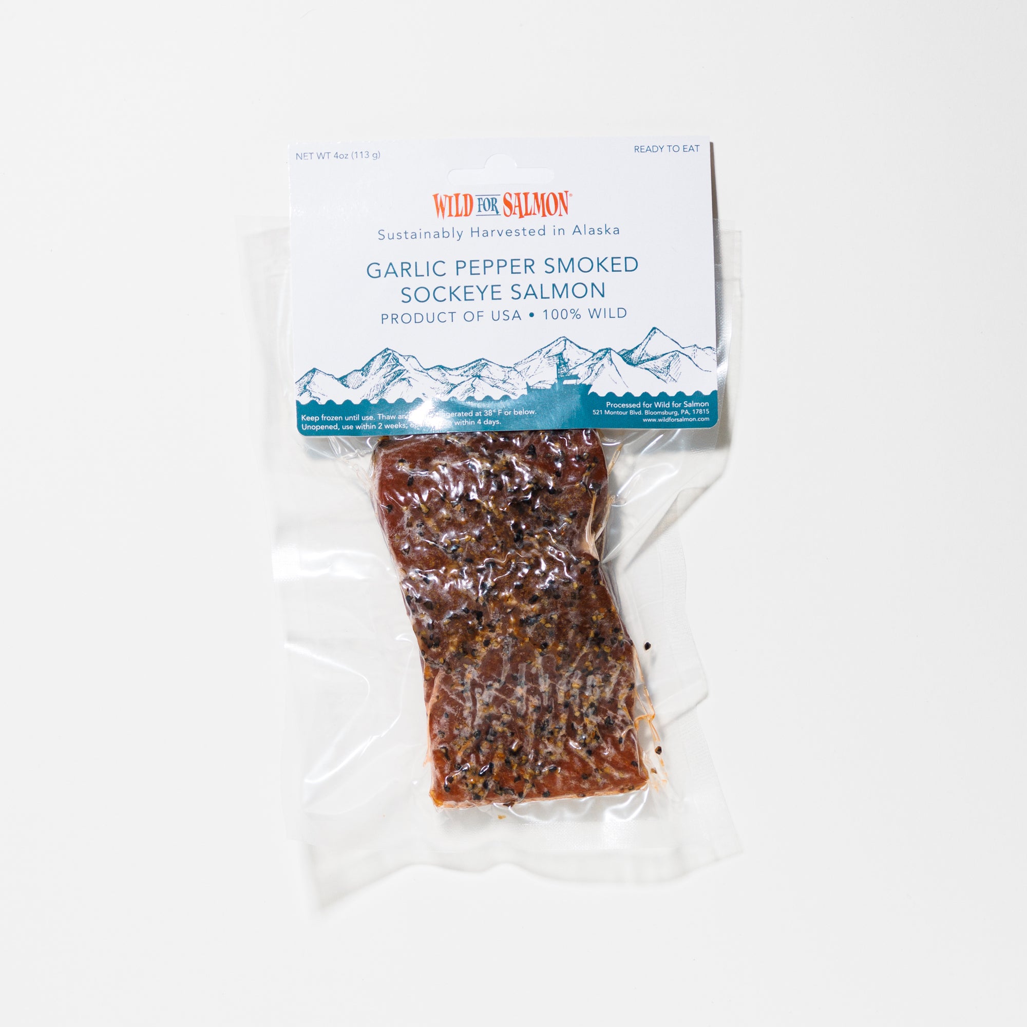 Packaged garlic smoked sockeye salmon with a Wild for Salmon label on a white background