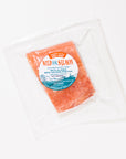 Packaged wild keta salmon with a label on a white background