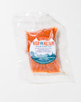 Packaged king salmon with a Wild for Slamon label on a white background