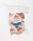 Packaged tuna medallions with a 'Wild for Salmon' label on a white background