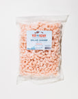 Packaged salad shrimp with a label on a white background